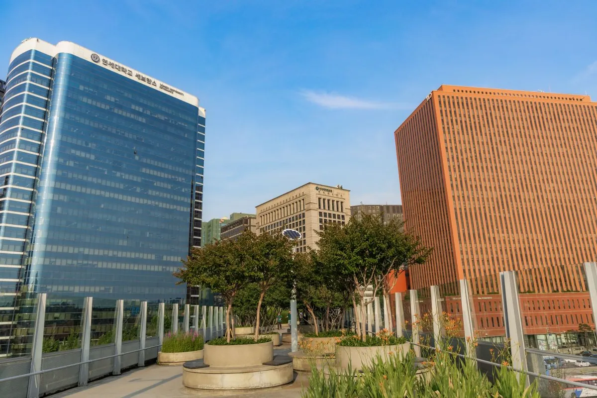 Pedestrian garden on Seoullo 7017 beside office towers near Seoul Station