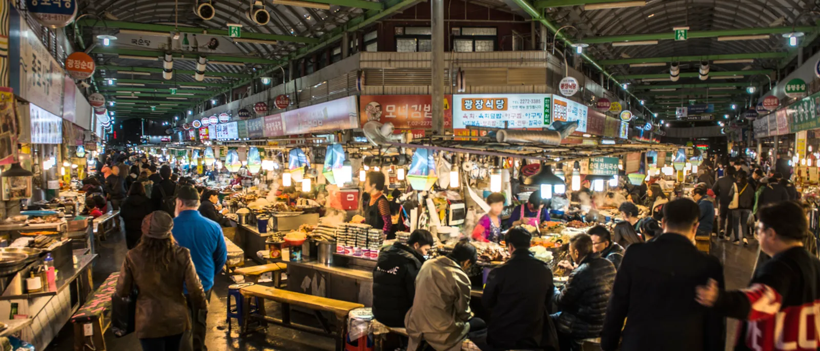 Busy evening food stalls inside Gwangjang Market in Seoul