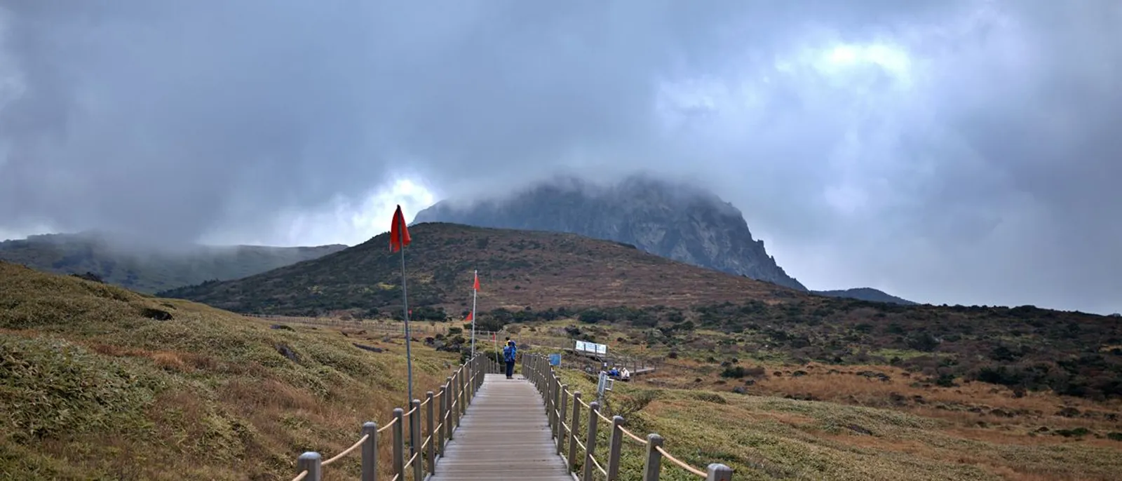 Boardwalk leading toward Hallasan's cloud-covered summit terrain